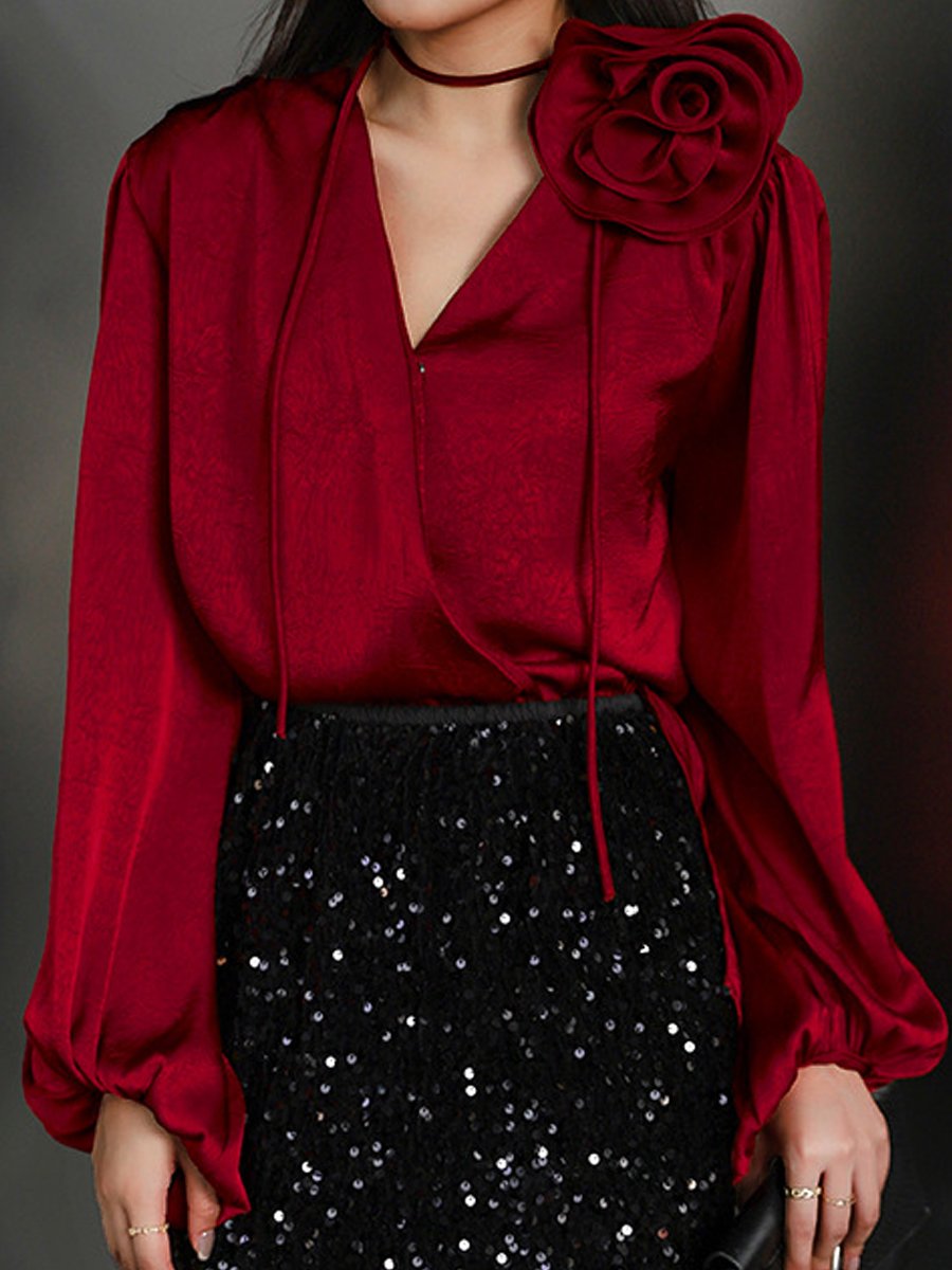 Stylish Wrap Blouse with Floral Accent