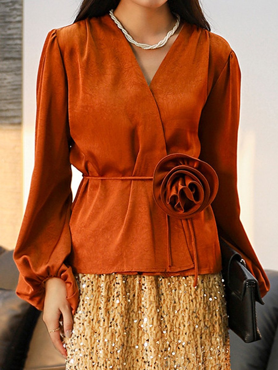 Stylish Wrap Blouse with Floral Accent
