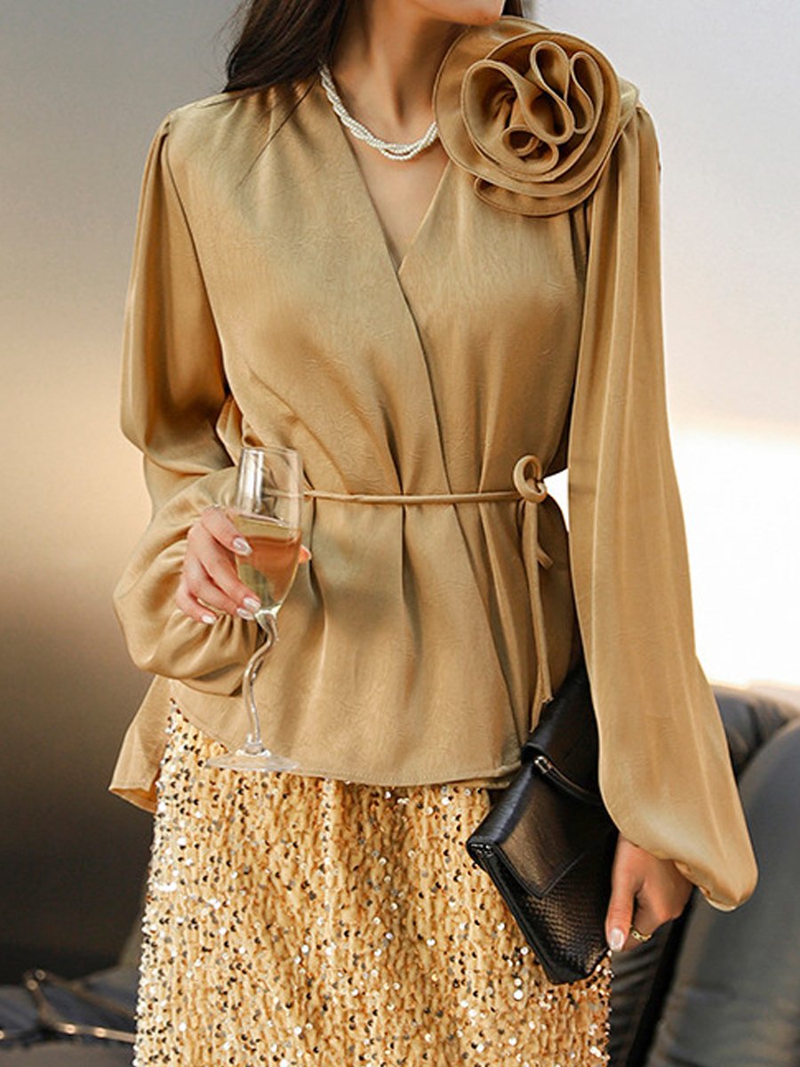 Stylish Wrap Blouse with Floral Accent